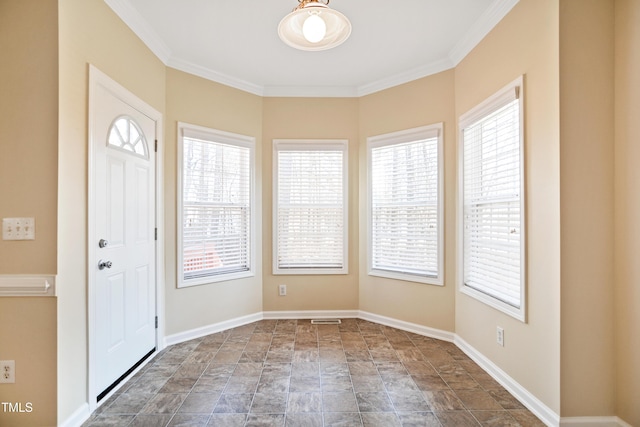 entryway featuring ornamental molding and a wealth of natural light