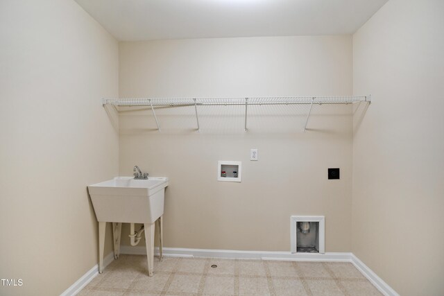 laundry area with laundry area, washer hookup, and baseboards