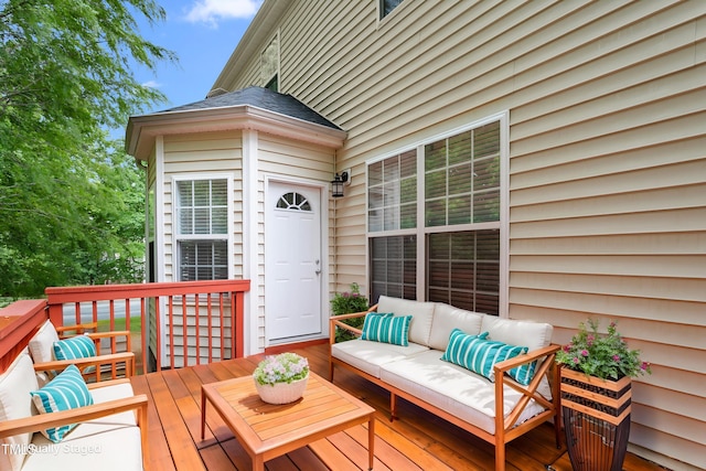 wooden deck with an outdoor living space