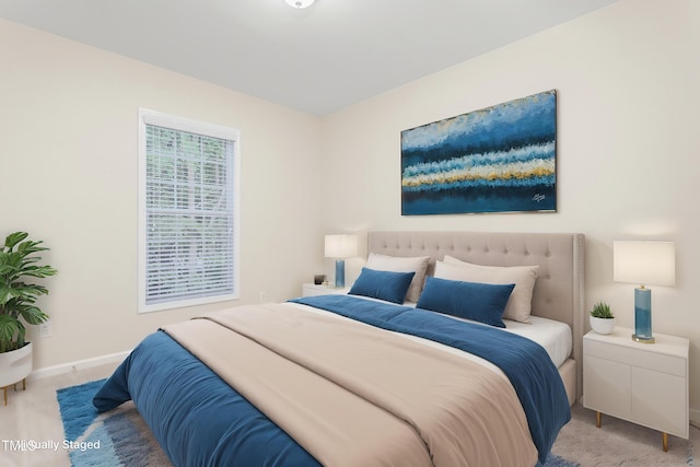 bedroom with carpet and baseboards