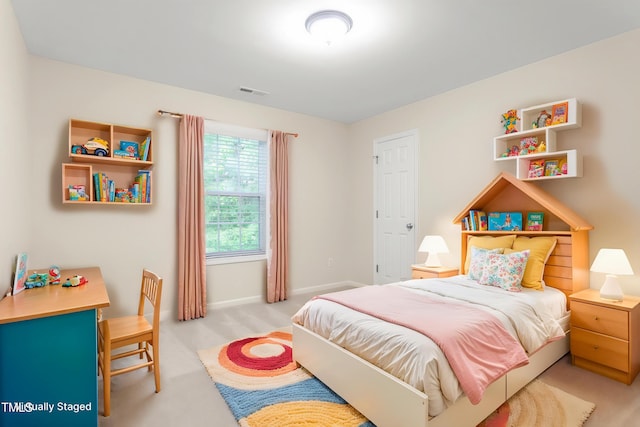 bedroom featuring baseboards and light colored carpet