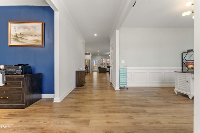 hall with recessed lighting, wainscoting, wood finished floors, and crown molding