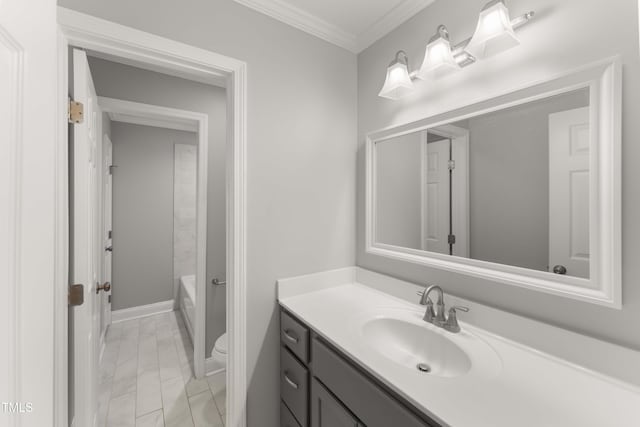 full bath with toilet, marble finish floor, vanity, and ornamental molding