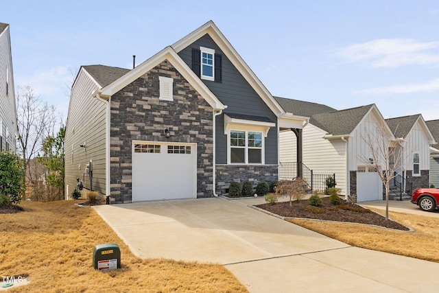 craftsman inspired home featuring stone siding and concrete driveway