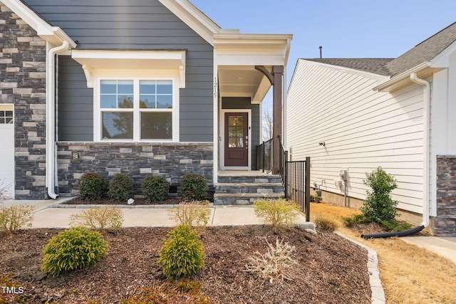 entrance to property with stone siding