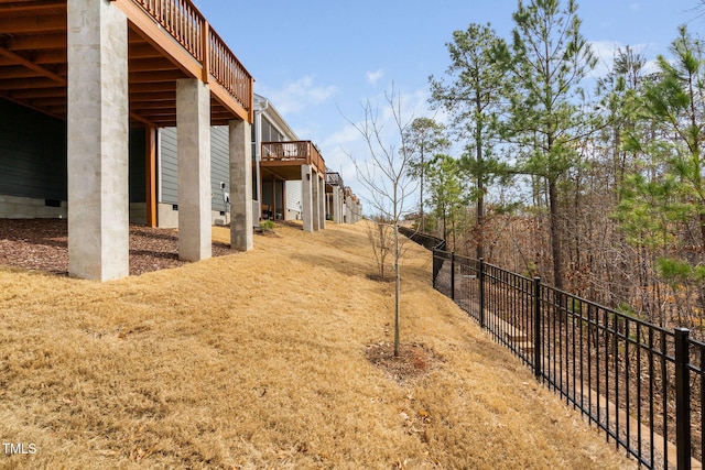 view of yard featuring stairs and fence