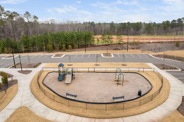 view of community with a view of trees