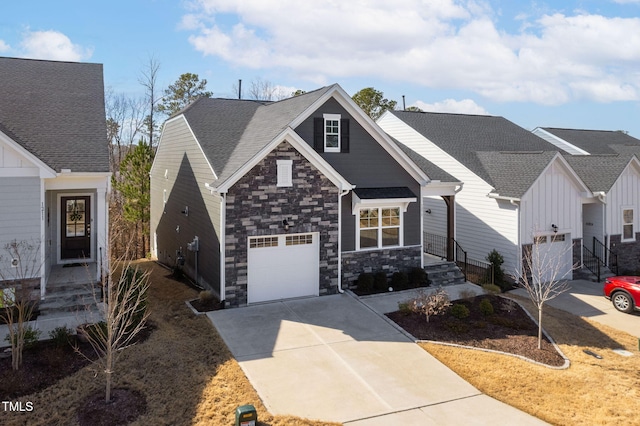 view of front of home featuring stone siding and driveway