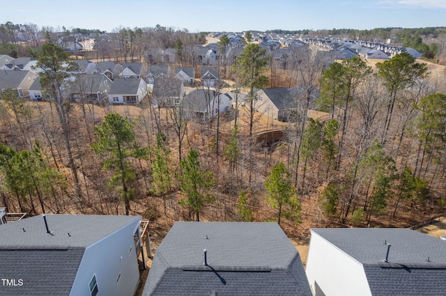 birds eye view of property with a residential view