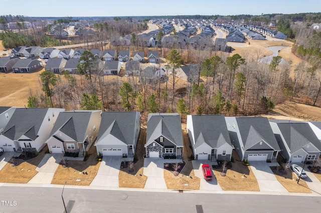 birds eye view of property with a residential view