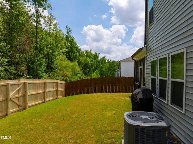view of yard featuring central AC unit