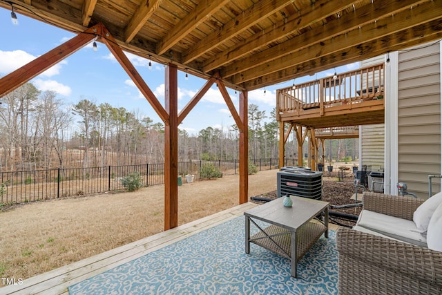 view of patio / terrace featuring central AC unit, a fenced backyard, and a wooden deck