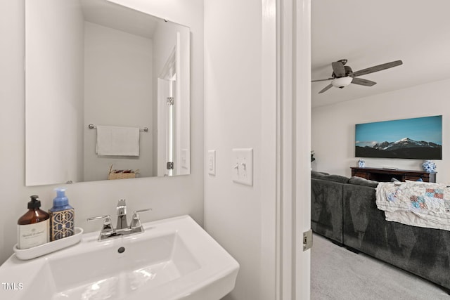 bathroom featuring ceiling fan and a sink