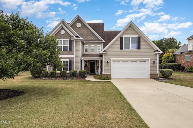 craftsman inspired home with concrete driveway, an attached garage, and a front lawn