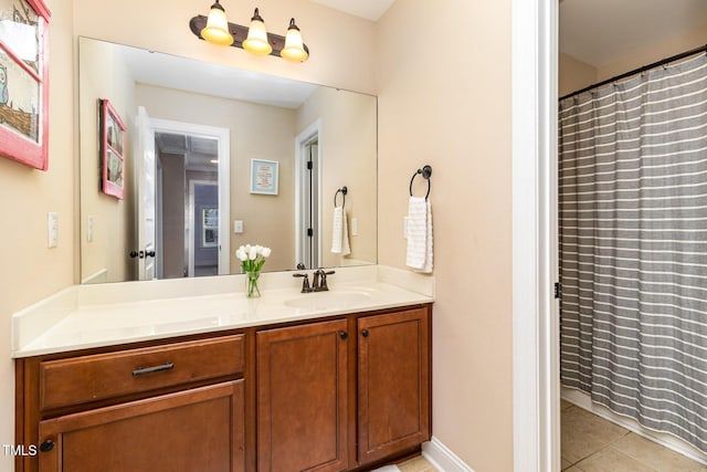 full bathroom with a shower with curtain, vanity, and tile patterned floors