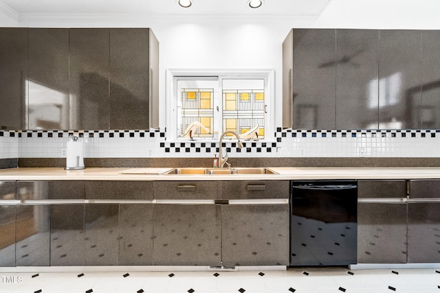 bathroom featuring crown molding, a sink, and tasteful backsplash