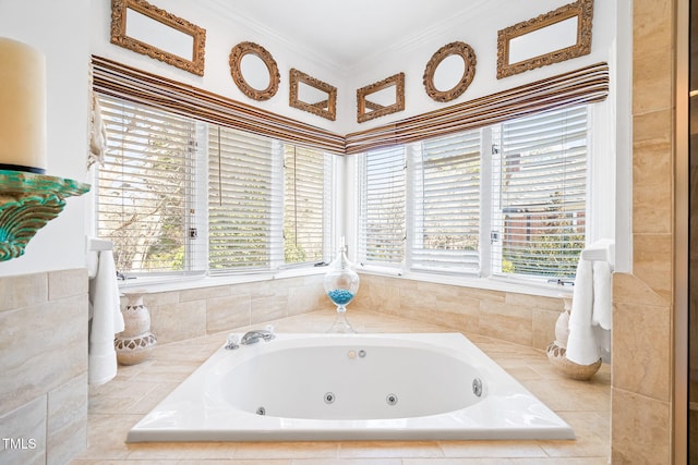 full bathroom with a whirlpool tub, a healthy amount of sunlight, and ornamental molding