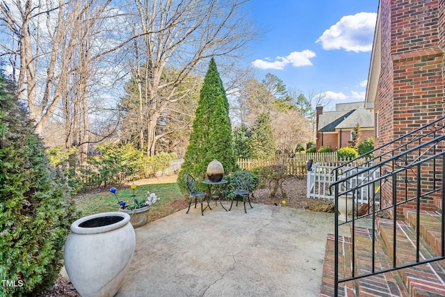 view of patio / terrace featuring fence