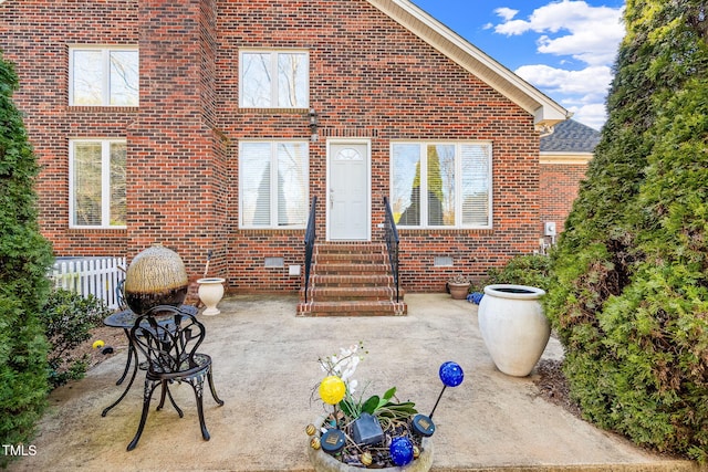 view of patio / terrace featuring entry steps and fence