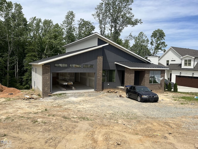 269 Deer Tail Ln Lot 44, Fuquay Varina, NC 27526 - mid-century home with brick siding and driveway