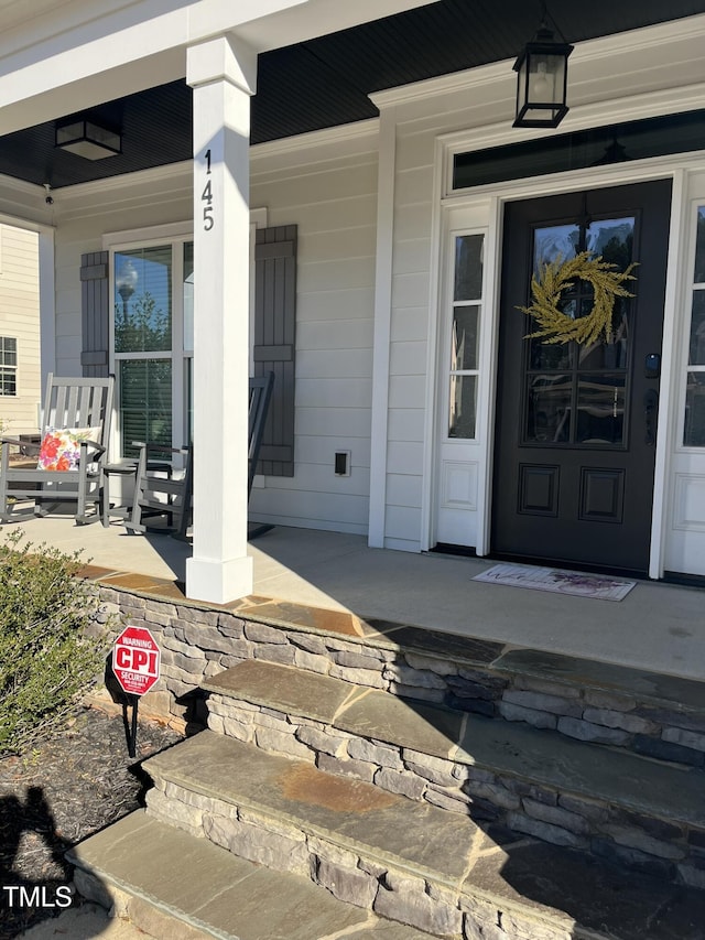 doorway to property featuring a porch