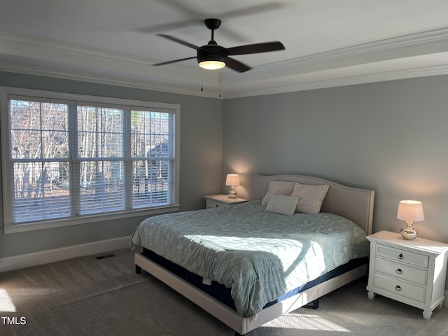 carpeted bedroom with baseboards, ceiling fan, visible vents, and crown molding