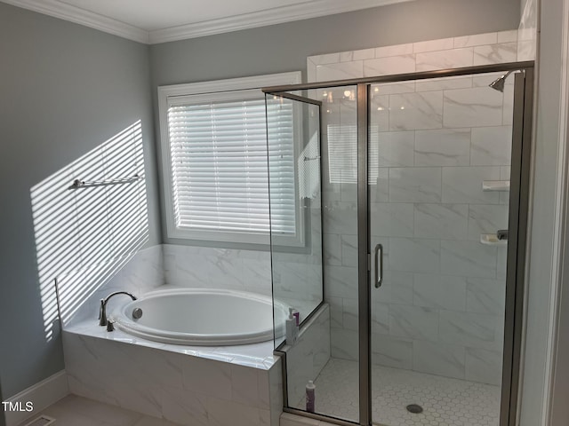 full bathroom featuring a stall shower, a garden tub, and crown molding