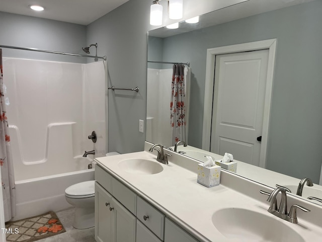 bathroom featuring toilet, shower / bathtub combination with curtain, double vanity, and a sink