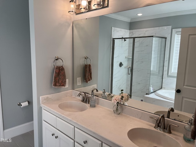 bathroom with baseboards, a stall shower, a sink, and crown molding