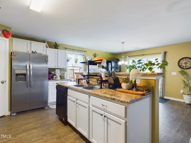 kitchen with decorative light fixtures, white cabinets, dishwasher, and stainless steel fridge with ice dispenser