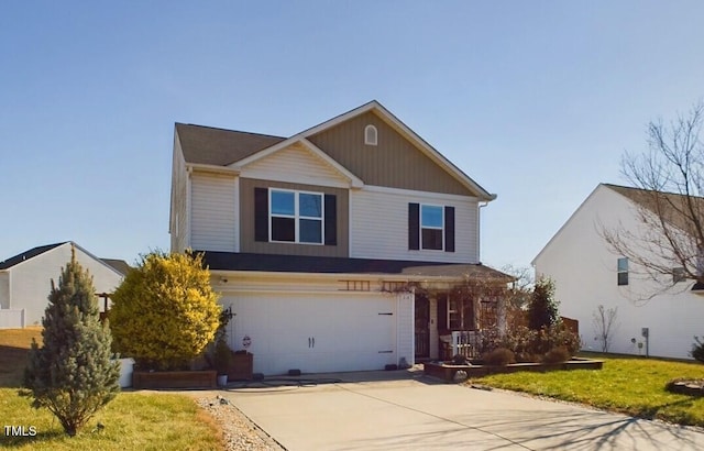 view of front of property featuring concrete driveway, a front lawn, and an attached garage