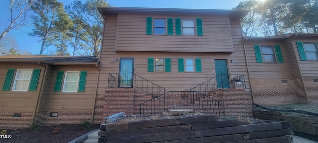 view of side of home featuring crawl space