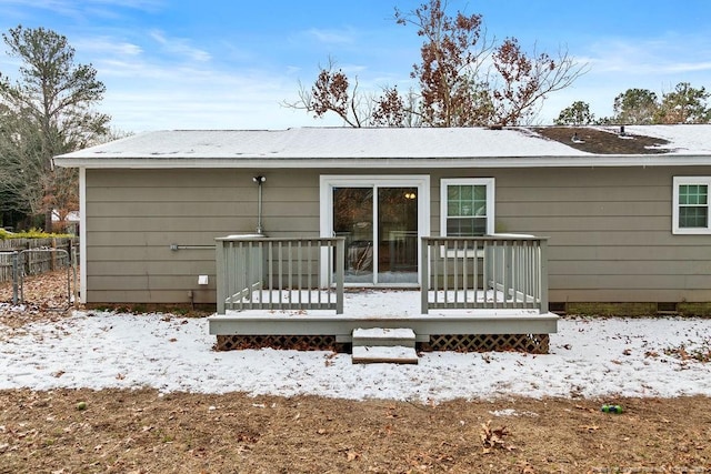 snow covered property featuring crawl space and a deck