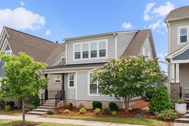 5520 Advancing Ave, Raleigh, NC 27616 - view of front facade with a standing seam roof, metal roof, and roof with shingles