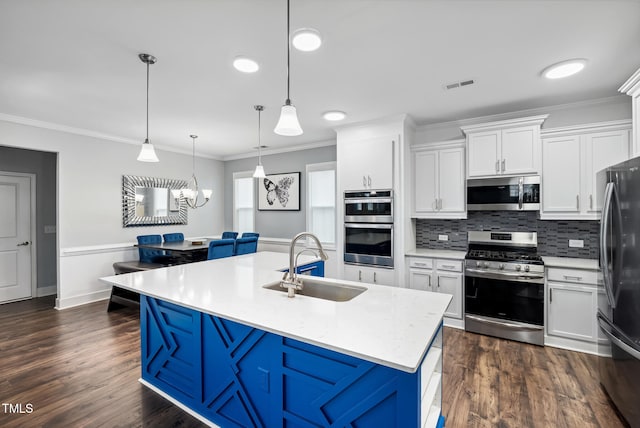5520 Advancing Ave, Raleigh, NC 27616 - kitchen featuring appliances with stainless steel finishes, a sink, crown molding, white cabinets, and tasteful backsplash