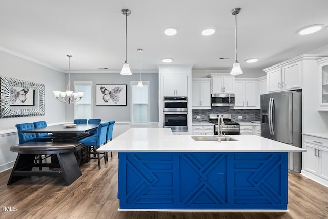 5520 Advancing Ave, Raleigh, NC 27616 - kitchen featuring stainless steel appliances, a sink, backsplash, white cabinetry, and crown molding