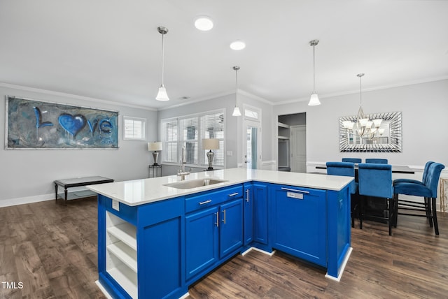 5520 Advancing Ave, Raleigh, NC 27616 - kitchen with a sink, blue cabinets, ornamental molding, a chandelier, and dark wood-type flooring