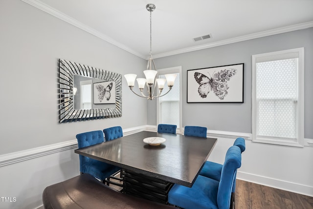 5520 Advancing Ave, Raleigh, NC 27616 - dining area featuring crown molding, a chandelier, wood finished floors, and baseboards