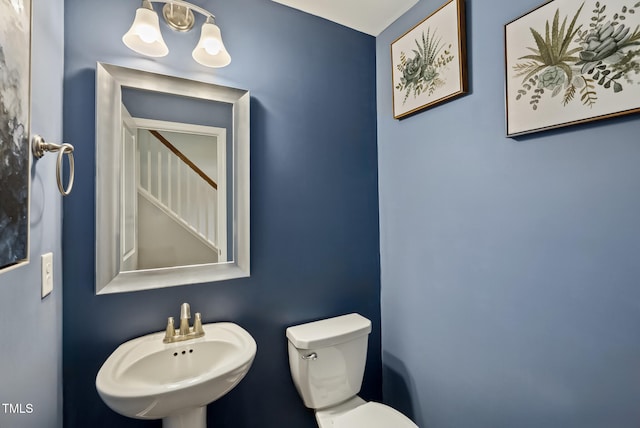 5520 Advancing Ave, Raleigh, NC 27616 - bathroom with a sink, toilet, and a chandelier