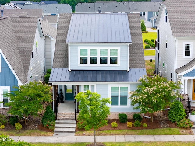 5520 Advancing Ave, Raleigh, NC 27616 - view of front of home with a standing seam roof, a residential view, a porch, metal roof, and roof with shingles