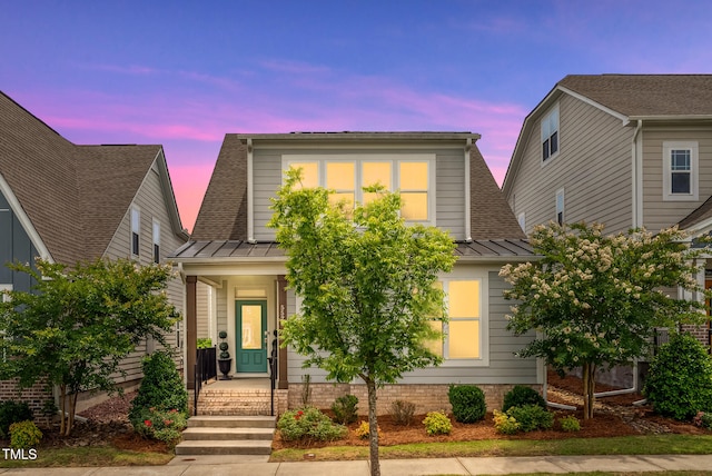 5520 Advancing Ave, Raleigh, NC 27616 - view of front of property featuring a standing seam roof, metal roof, a shingled roof, and covered porch