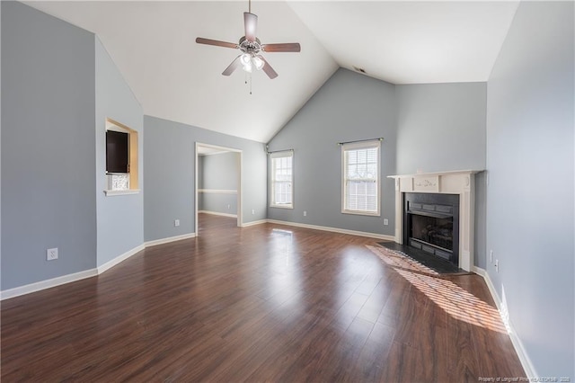 unfurnished living room featuring dark wood-style floors, a fireplace with flush hearth, baseboards, and a ceiling fan