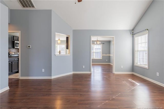 unfurnished living room featuring lofted ceiling, dark wood-style floors, baseboards, and visible vents