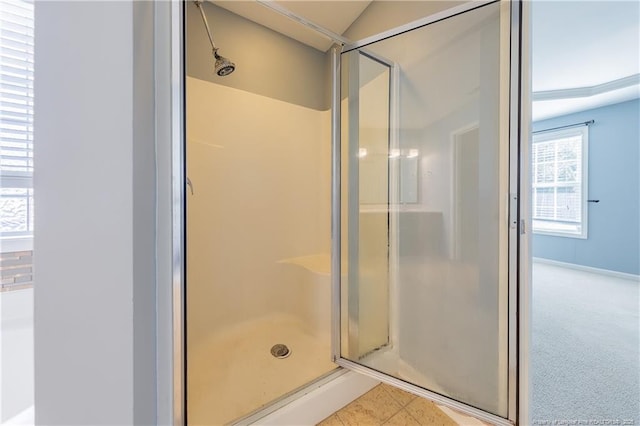 full bath with tile patterned flooring and a shower stall