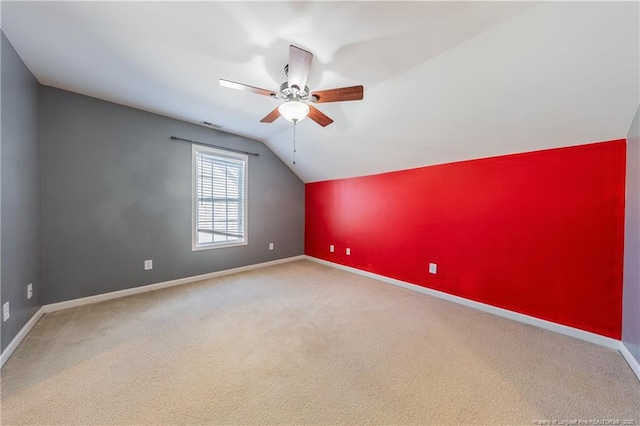 bonus room featuring ceiling fan, visible vents, baseboards, vaulted ceiling, and carpet