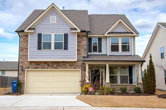 craftsman-style house with stone siding, an attached garage, roof with shingles, and driveway