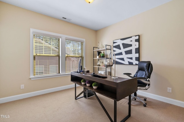 office space with visible vents, baseboards, and carpet floors