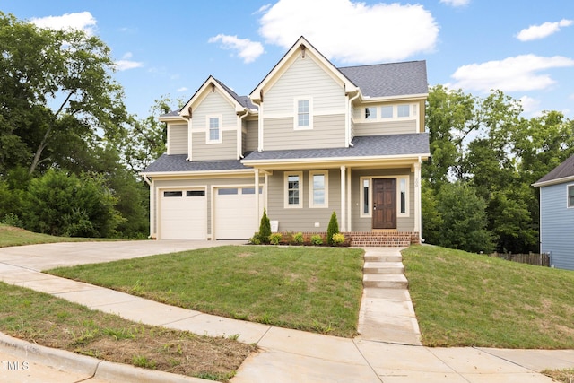 view of front of home featuring a front lawn, concrete driveway, roof with shingles, and an attached garage