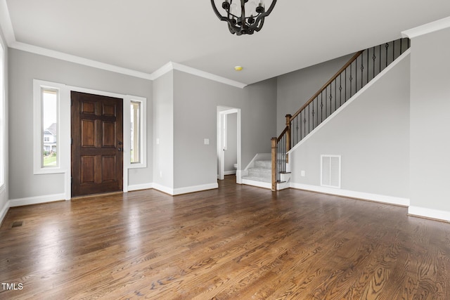 entryway featuring stairs, wood finished floors, visible vents, and baseboards