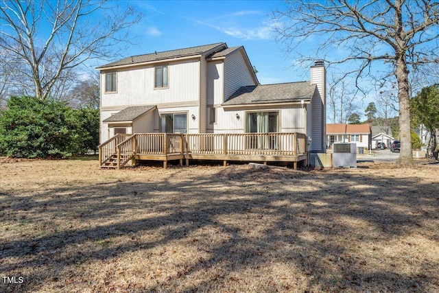 back of house featuring a deck and a chimney